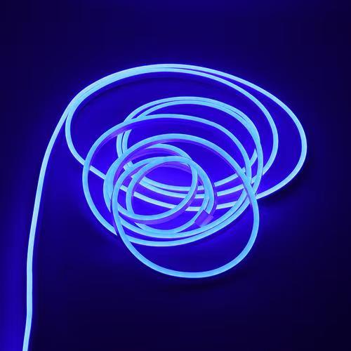 Coiled blue silicone neon flex light glowing against a dark background, showcasing flexibility and bright illumination.