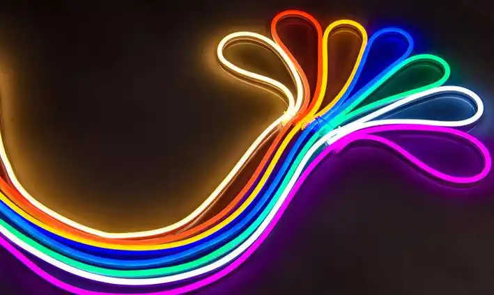 Flexible silicone neon flex lights in vibrant rainbow colors, arranged in curved loops against a dark background.