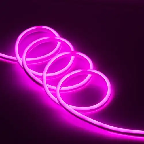 Pink silicone neon flex light loops emitting vibrant and flexible illumination against a dark background.